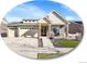 Charming home featuring a three car garage, stone accents, and a well maintained lawn at 5474 Espana St, Denver, CO 80249