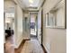 Bright foyer featuring hardwood flooring and neutral paint at 5474 Espana St, Denver, CO 80249