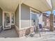 Inviting front porch with seating area at 5474 Espana St, Denver, CO 80249