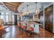 Open kitchen boasts a center island, pendant lights, and modern appliances at 5474 Espana St, Denver, CO 80249