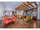 Bright living room with stylish seating, a fireplace, and custom built-ins at 5474 Espana St, Denver, CO 80249
