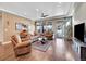 Cozy living room with comfortable seating, area rug, and large windows at 5474 Espana St, Denver, CO 80249