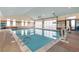 Indoor pool area with retractable doors for open-air swimming at 5474 Espana St, Denver, CO 80249