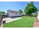 Spacious backyard with a well-maintained lawn and partial fencing at 4268 S Delaware St, Englewood, CO 80110