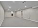 Spacious basement featuring recessed lighting and neutral carpeting, ready for your personal touch at 4268 S Delaware St, Englewood, CO 80110