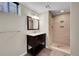 Updated bathroom with tiled walk-in shower, stylish vanity, and a contemporary design at 4268 S Delaware St, Englewood, CO 80110