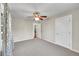 Bright bedroom with neutral walls, plush carpeting, and a ceiling fan at 4268 S Delaware St, Englewood, CO 80110