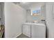 Basement laundry room featuring a white washer and dryer at 4268 S Delaware St, Englewood, CO 80110