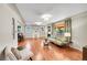 Spacious living room features hardwood floors, a decorative fireplace, and large windows at 4268 S Delaware St, Englewood, CO 80110