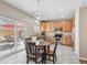 Bright kitchen with stainless steel appliances and view to backyard patio at 7342 S Mobile St, Aurora, CO 80016