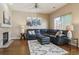 Cozy living room featuring hardwood floors, fireplace, and modern decor at 7342 S Mobile St, Aurora, CO 80016