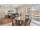 Living room with access to backyard and view of patio and ample seating at 7342 S Mobile St, Aurora, CO 80016