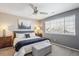 Comfortable main bedroom with a ceiling fan, and two end tables at 7342 S Mobile St, Aurora, CO 80016