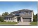 Charming two-story home with a two-car garage, a stone foundation, gray siding, and manicured landscaping at 630 Sunrise St, Erie, CO 80516