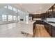 Bright kitchen featuring stainless steel appliances, quartz countertops, and an open concept layout at 630 Sunrise St, Erie, CO 80516