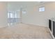 Bright loft space featuring cozy carpet, and stairway overlooking the living room at 630 Sunrise St, Erie, CO 80516