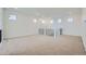 Open and bright loft space with carpet, large windows, and views of staircase at 630 Sunrise St, Erie, CO 80516