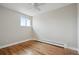 Cozy bedroom with hardwood floors, neutral paint and ceiling fan at 1045 W 97Th Ave, Northglenn, CO 80260