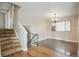 Inviting living room with hardwood floors and stairs to an upper level at 1045 W 97Th Ave, Northglenn, CO 80260