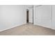 Bright bedroom with plush carpeting and closet and ensuite bathroom access at 240 Lark Sparrow Way, Bennett, CO 80102
