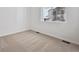 Bright bedroom features plush carpeting, a neutral palette, and a window at 240 Lark Sparrow Way, Bennett, CO 80102