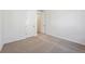 Bright bedroom with plush carpeting and closet and ensuite bathroom access at 240 Lark Sparrow Way, Bennett, CO 80102