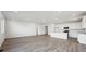Expansive living area featuring an open floor plan, recessed lighting, and a modern kitchen with a center island at 240 Lark Sparrow Way, Bennett, CO 80102