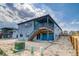 Back of the home features a deck with stairs to backyard and walk-out basement at 39210 Anthony St, Elizabeth, CO 80107