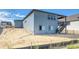 Backyard with stairs leading up to deck on back of house at 39210 Anthony St, Elizabeth, CO 80107