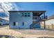 Back of house with deck and stairs in backyard at 39210 Anthony St, Elizabeth, CO 80107