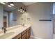 Bathroom features a double sink vanity, sleek fixtures, a large mirror and contemporary lighting at 39210 Anthony St, Elizabeth, CO 80107