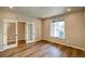 Cozy bedroom with wood floors, glass doors, and natural light at 39210 Anthony St, Elizabeth, CO 80107