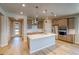 Well-equipped kitchen with stainless steel appliances, an island, wood floors, and ample storage at 39210 Anthony St, Elizabeth, CO 80107