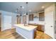 Stylish kitchen featuring a center island, modern pendant lights, and updated cabinets at 39210 Anthony St, Elizabeth, CO 80107
