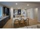 Spacious kitchen with long island, stainless steel appliances and connected to the living room at 39210 Anthony St, Elizabeth, CO 80107