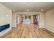 Bright, open living space with wood floors, a fireplace, and views into the kitchen at 39210 Anthony St, Elizabeth, CO 80107