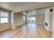 Bright living space with wood floors, a fireplace, and sliding glass doors to the patio at 39210 Anthony St, Elizabeth, CO 80107