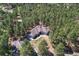 An aerial view of the home surrounded by tall trees at 4726 Pinon Dr, Elizabeth, CO 80107