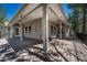 Inviting back deck featuring ample seating and space for relaxation with a covered roof and support beams at 4726 Pinon Dr, Elizabeth, CO 80107