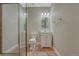 Modern bathroom featuring a glass shower, tile floors, and a white vanity at 4726 Pinon Dr, Elizabeth, CO 80107