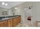 Bathroom boasting granite countertops and double sinks, creating a luxurious and functional space at 4726 Pinon Dr, Elizabeth, CO 80107