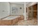 This bathroom features a separate shower and a soaking tub, providing a spa-like experience at 4726 Pinon Dr, Elizabeth, CO 80107