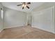 Bedroom showcasing a neutral color palette, carpeted floors, and double sliding door closet for storage at 4726 Pinon Dr, Elizabeth, CO 80107