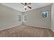 Bedroom featuring neutral colors, a ceiling fan and windows at 4726 Pinon Dr, Elizabeth, CO 80107