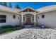Inviting front entrance with rock landscaping and a red front door at 4726 Pinon Dr, Elizabeth, CO 80107