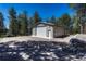 Large garage with ample parking space and separate entrance, perfect for storage and workshop or business at 4726 Pinon Dr, Elizabeth, CO 80107