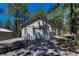 Garage with white door and driveway at 4726 Pinon Dr, Elizabeth, CO 80107