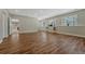 Expansive living room featuring wood floors, natural light, and a versatile open floor plan at 4726 Pinon Dr, Elizabeth, CO 80107