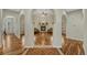 Elegant living room featuring hardwood floors, a fireplace, and arched doorways at 4726 Pinon Dr, Elizabeth, CO 80107