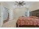 Main bedroom features a ceiling fan, carpet, and an exterior door to the outside at 4726 Pinon Dr, Elizabeth, CO 80107